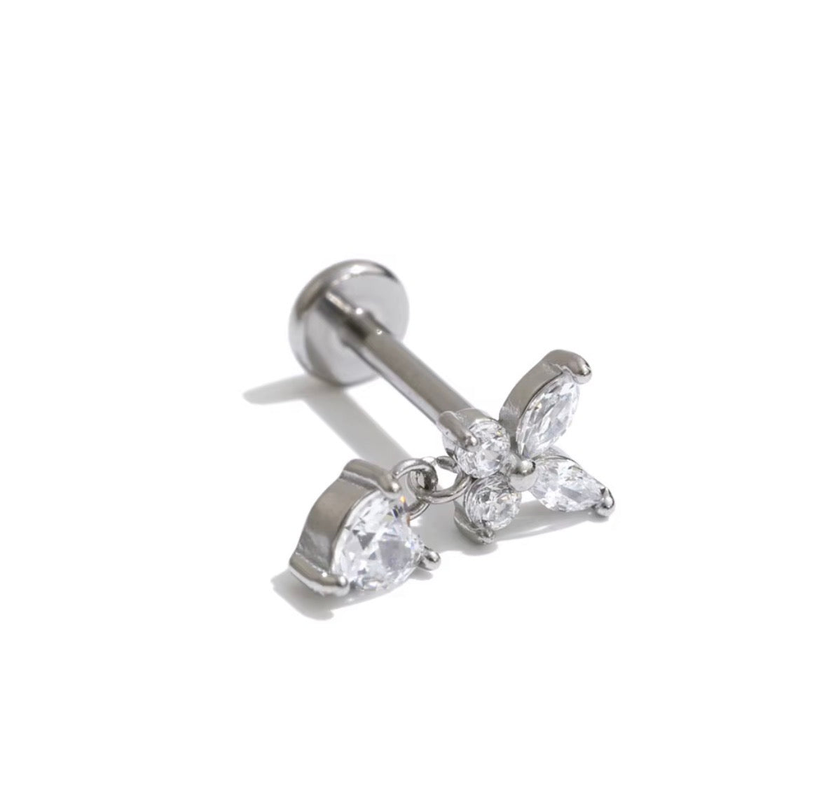 Gold butterfly charm stud earring displayed on The Seventh Edit branded pouch 