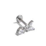 Gold butterfly charm stud earring displayed on The Seventh Edit branded pouch 