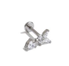 Gold butterfly charm stud earring displayed on The Seventh Edit branded pouch 