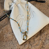 Silver beaded bar chain necklace with turquoise bead accents and a rectangular mother of pearl pendant, uk jewellery 
