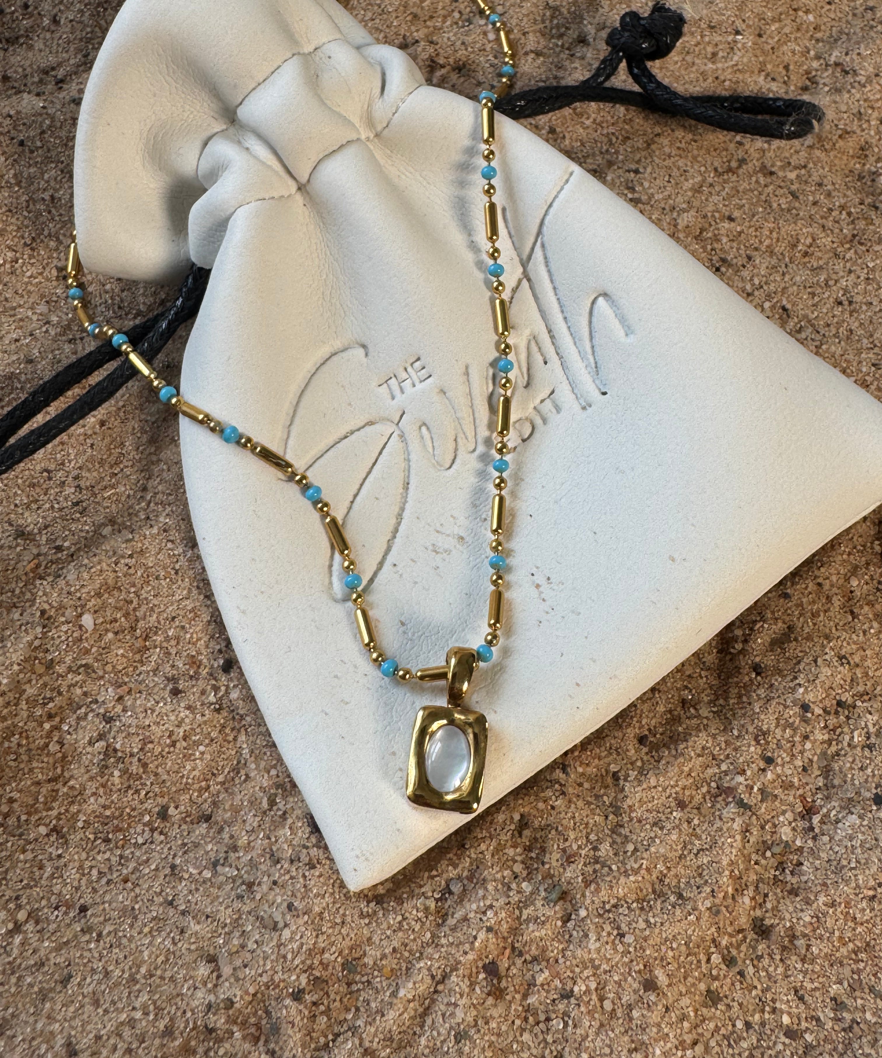 Silver beaded bar chain necklace with turquoise bead accents and a rectangular mother of pearl pendant, uk jewellery 