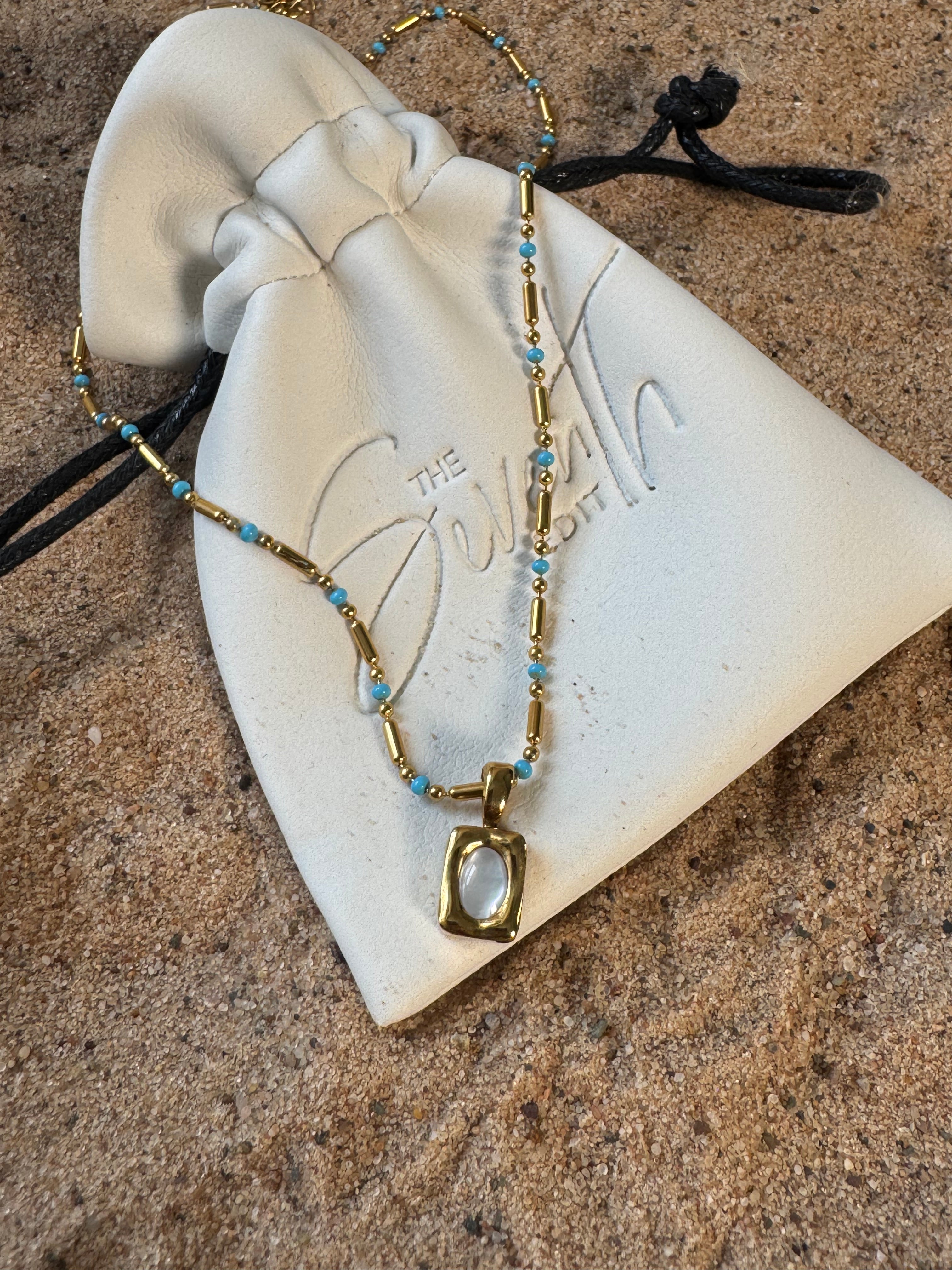 Silver beaded bar chain necklace with turquoise bead accents and a rectangular mother of pearl pendant, uk jewellery 