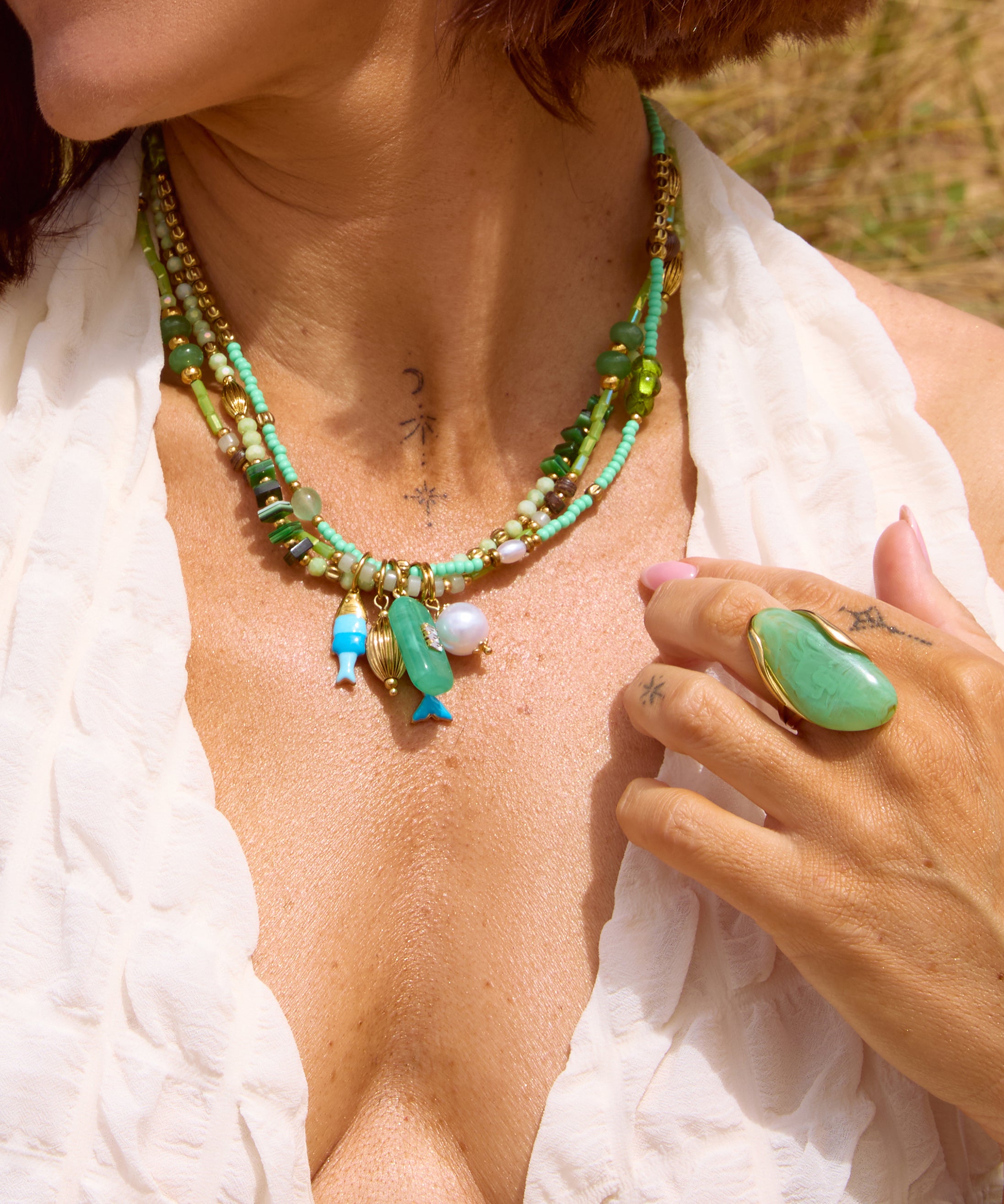 Handcrafted multi-strand beaded necklace in green and turquoise tones, featuring malachite, jade and seed beads with gold accents Uk jewellery 